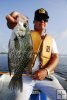 Angler with big black crappie Angler with big black crappie
