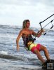 Kite surfer one-handed run Kite surfer one-handed run